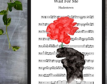 May include: A watercolor painting of a red flower being held by a black hand. The painting is set against a background of sheet music with the title "Wait For Me" and the subtitle "Hadestown".