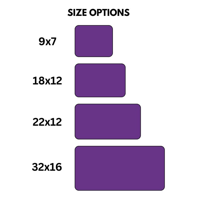 May include: Image showing size options. The text "SIZE OPTIONS" is at the top. Four purple rectangles with rounded corners are displayed, representing sizes: 9x7 inches (22.86 x 17.78 cm), 18x12 inches (45.72 x 30.48 cm), 22x12 inches (55.88 x 30.48 cm), and 32x16 inches (81.28 x 40.64 cm).