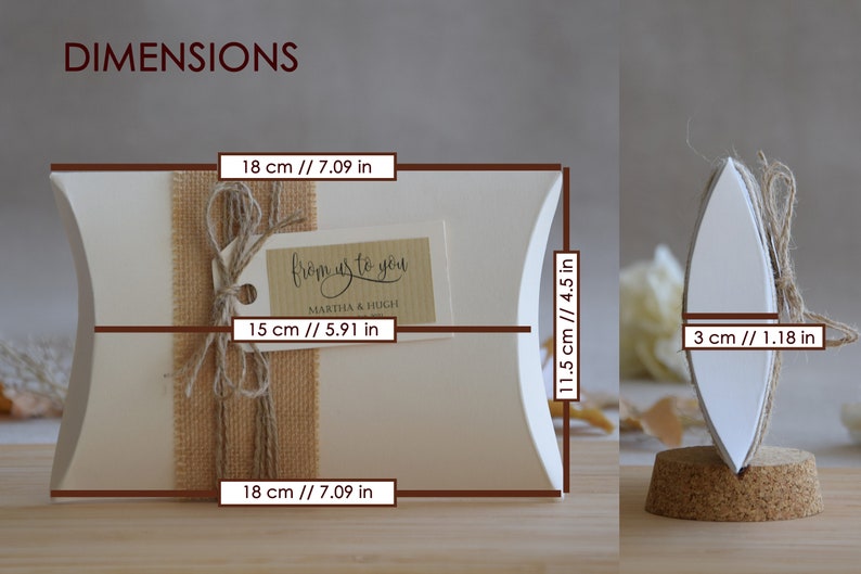 May include: White pillow box with a burlap ribbon and a gift tag that says "from us to you Martha & Hugh". The box measures 18 inches by 11.5 inches by 3 inches.