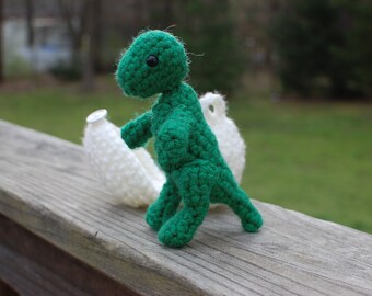 Dinosaurios bebés con huevo para incubar