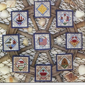 May include: The Prairie Schooler Book No. 171 features cross-stitch patterns with a nautical theme. The cover displays several small, square designs with images of a boat, lighthouse, and American flag. The words "Sunny Days" are at the bottom.