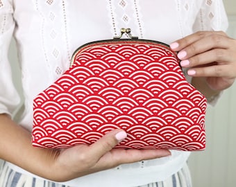 Woman's clutch bag in red & white geometric wave fabric