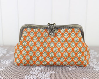 Retro clutch purse for halloween party: orange and green