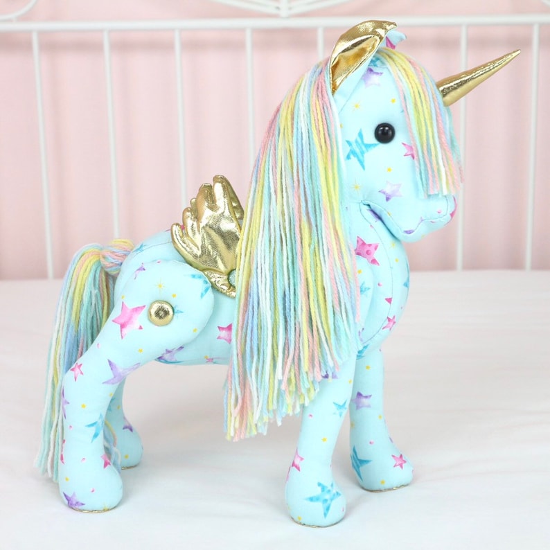 Download Blue unicorn doll with gold horn gold wings rainbow hair ...