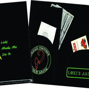 May include: Black wallet with a green embroidered logo that says "Loki's Army" and a smaller green embroidered logo that says "Proud Member Loki's Army". The wallet has a pocket for cash and a pocket for cards.