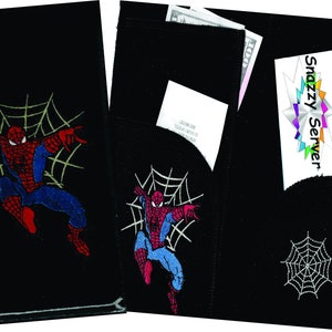 May include: Two black fabric wallets with a Spiderman design. One wallet has a pocket for cash and a receipt. The other wallet has a pocket for cash and a business card. Both wallets have a spiderweb design.
