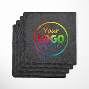 May include: Set of six black slate coasters with rounded edges. The top coaster features a rainbow circle with the text "Your Logo Printed" in white.