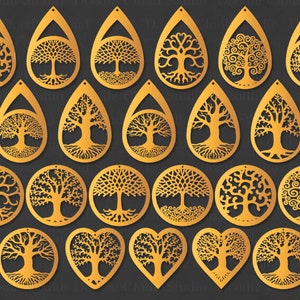 Könnte beinhalten: Ein Set mit 18 goldfarbenen Lebensbaum-Ohrringen. Die Ohrringe haben verschiedene Formen, darunter Tropfen, Kreis und Herz. Einige Ohrringe haben komplizierte Designs, während andere einfacher sind.