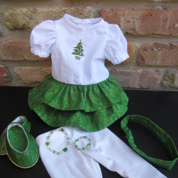 Christmas outfit for 18 in doll includes ruffled dress with Christmas tree embroidery on bodice, leggings, shoes, headband and bracelet set.