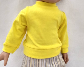 Yellow long sleeve knit shirt for 18 inch doll. Striped doll pants.