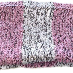 May include: A soft, chunky knit throw blanket with stripes of pink, white, and gray yarn.