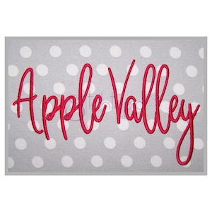 May include: Red cursive text on a gray background with white polka dots that reads "Apple Valley".
