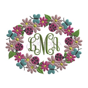 May include: A green monogram "M" surrounded by a wreath of pink and white flowers, green leaves, blue butterflies, and red ladybugs.