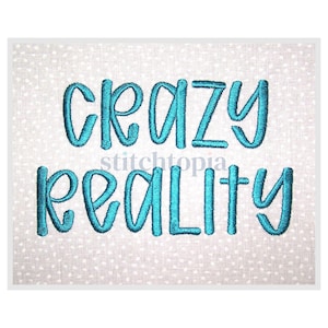 May include: A teal embroidered design on a light gray fabric with a white polka dot pattern. The text reads "CRAZY REALITY" in a whimsical, cursive font. The word "stitchtopia" is written in a smaller font between the words.