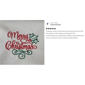 May include: Red and green embroidered design on a white fabric background. The design says "Merry Christmas" with a holly leaf and berry.