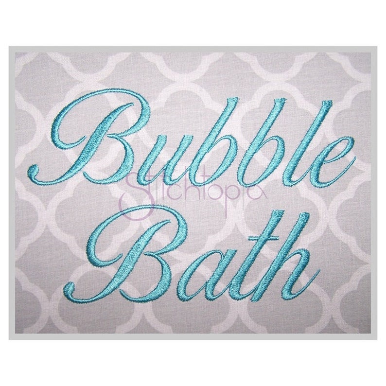 May include: Embroidered design in a teal blue color on a gray background. The design reads "Bubble Bath" in a cursive font.