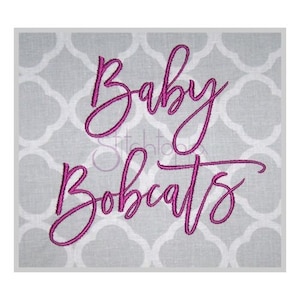 May include: Pink embroidered design on a gray fabric background. The design says "Baby Bobcats".