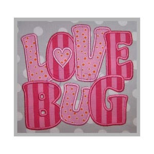 May include: Pink and orange applique letters spelling "LOVE BUG" with a small pink heart in the "O".