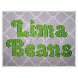 May include: Green embroidered text on a grey background that reads "Lima Beans".