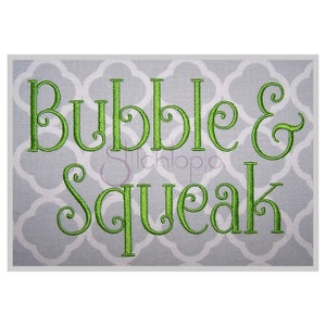 May include: Green embroidered text on a gray background that reads "Bubble & Squeak".