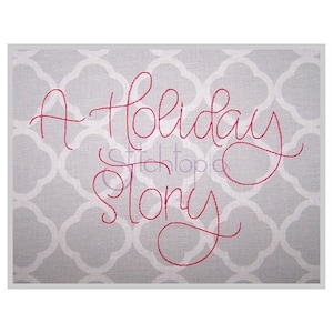 May include: A red embroidered design on a gray fabric background. The design reads "A Holiday Story".