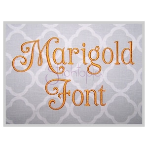 May include: Marigold Font embroidery design in a gold color on a gray fabric background.