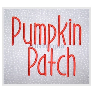 May include: A square, embroidered design with the words "Pumpkin Patch" in red thread. The text is in a whimsical, handwritten style. The background is a light gray fabric with small white polka dots.