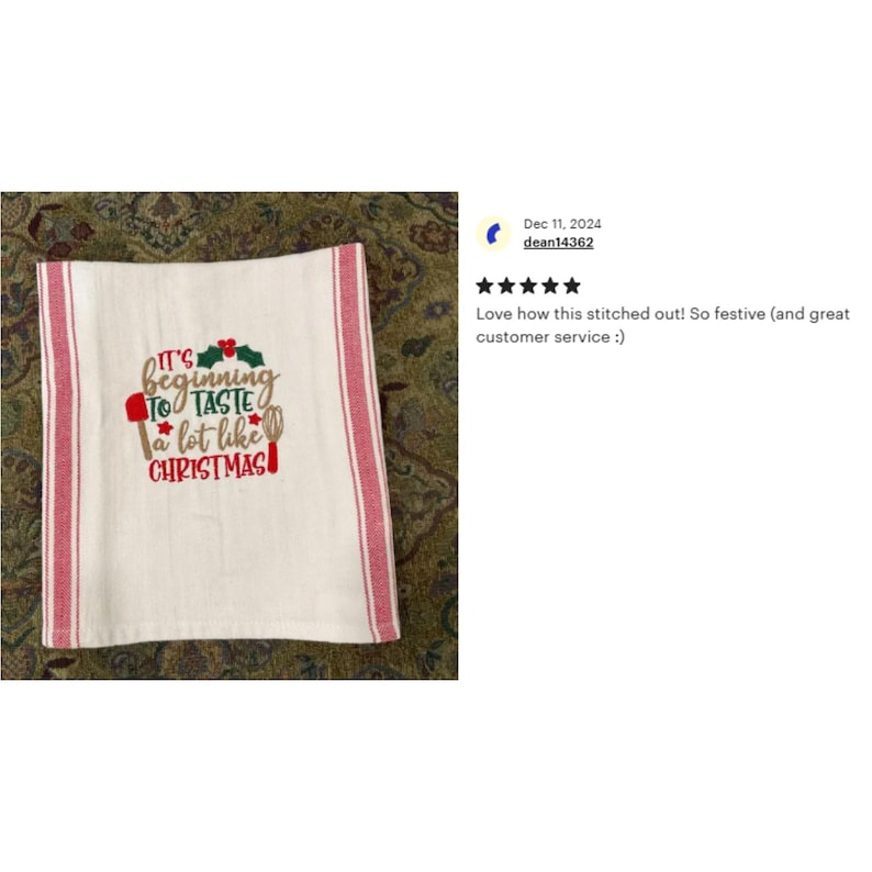 May include: White kitchen towel with red and white stripes. The towel has an embroidered design that says "It's beginning to taste a lot like Christmas" with a red and green holly sprig, a red spatula, and a whisk.