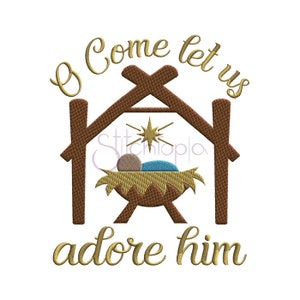 May include: A gold embroidered design of a manger scene with a baby Jesus, a star, and the words "O Come Let Us Adore Him".