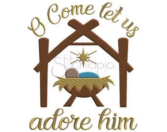 May include: A gold embroidered design of a manger scene with a baby Jesus, a star, and the words "O Come Let Us Adore Him".