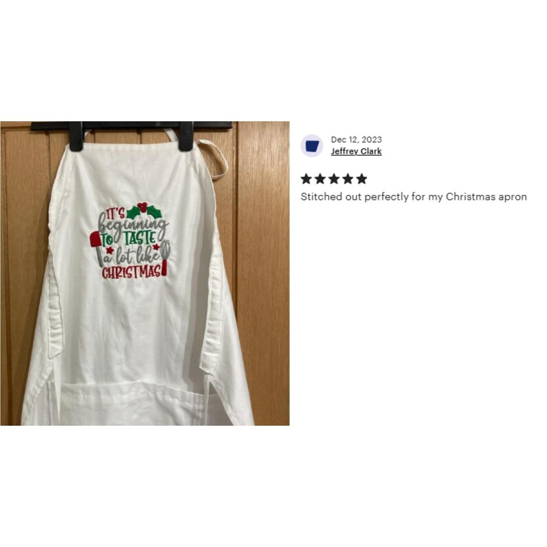 May include: White kitchen apron with red and green embroidery that reads "It's beginning to taste a lot like Christmas".