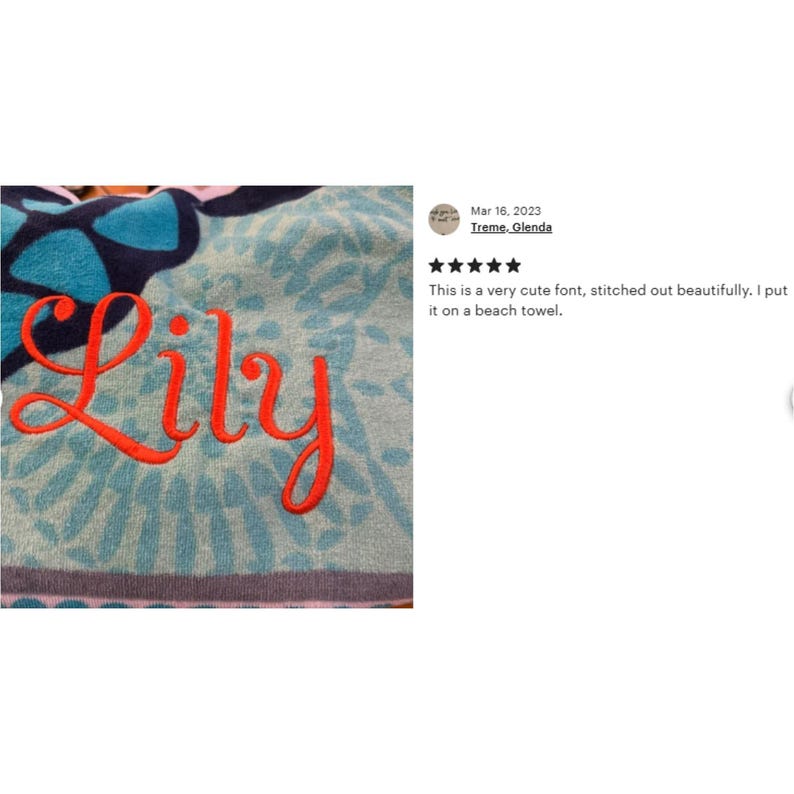 May include: A blue and white beach towel with a floral pattern. The name "Lily" is embroidered in red on the towel.