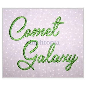 May include: Green embroidered text on a white background with small white dots. The text reads "Comet Galaxy".