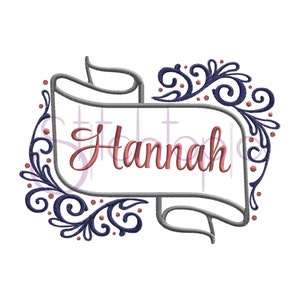 May include: Embroidered design featuring a banner with the name "Hannah" in a pink font. The banner is decorated with gray scrollwork and blue floral accents.