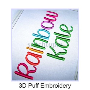 May include: 3D puff embroidery of the words "rainbow kale" in a rainbow of colors on a white background.