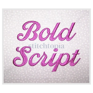 May include: A white fabric with a polka dot pattern, embroidered with the words "Bold Script" in magenta. The word "stitchtopia" is also visible. The script is in a bold, decorative font.