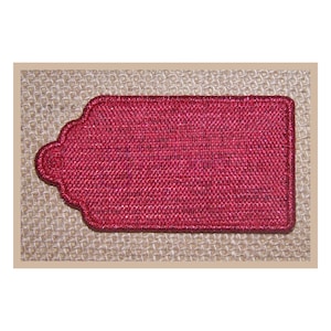 May include: A red fabric tag with a scalloped edge. The tag is blank and ready for personalisation.