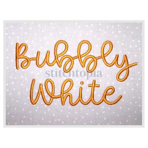 May include: Embroidered design with the text "bubbly white" in a gold cursive font on a white background with small white dots.