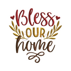 May include: Embroidered design with the words "Bless Our Home" in red, gold, and brown. The word "Bless" is in a cursive font, with two red hearts. Gold leaves surround the words "Our" and "Home".