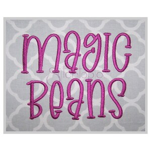 May include: Embroidered design of the phrase "magic beans" in a pink cursive font on a gray background.