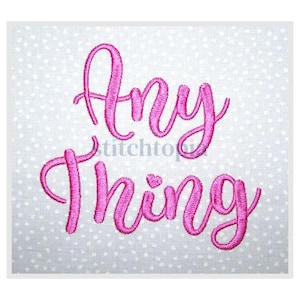 May include: A square, white fabric with a light grey polka dot pattern. The words "Any Thing" are embroidered in a bright pink, cursive font. A small heart is embroidered above the "i" in "Thing".