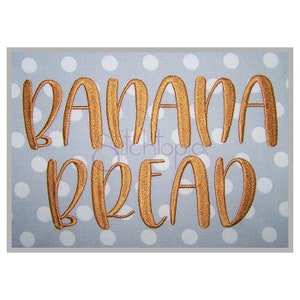 May include: Embroidered design on a light blue fabric with white polka dots. The design reads "BANANA BREAD" in a gold color.
