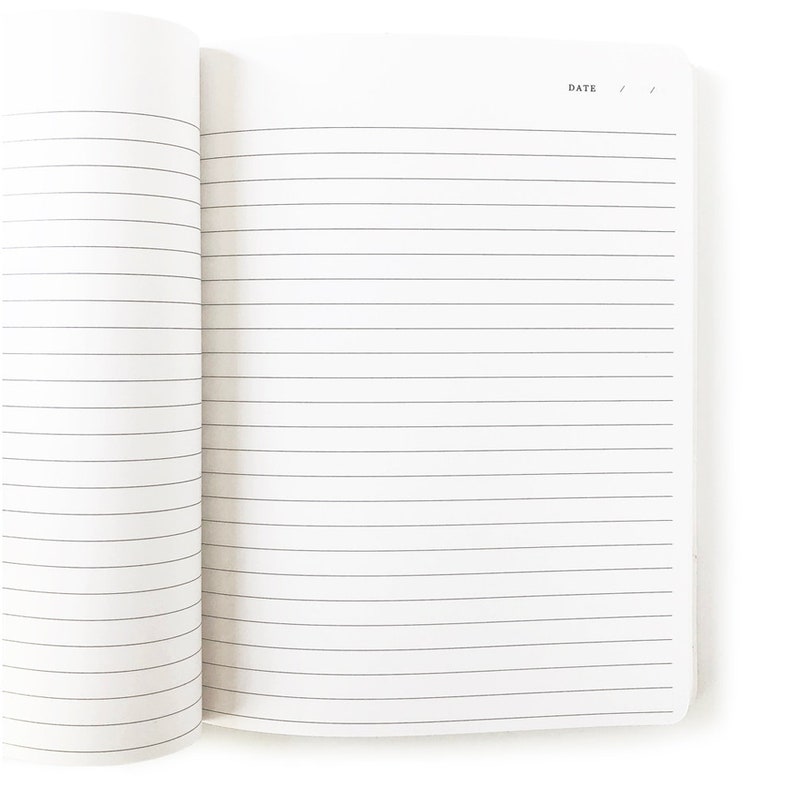 May include: An open notebook with lined pages and the word "DATE" printed at the top.