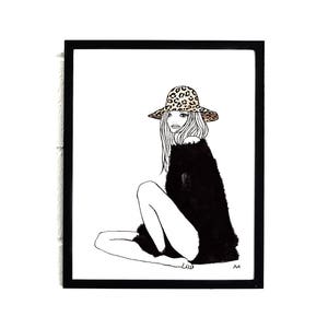 May include: Black and white line drawing of a person wearing a leopard print hat and a black sweater. The person is sitting with their legs crossed.