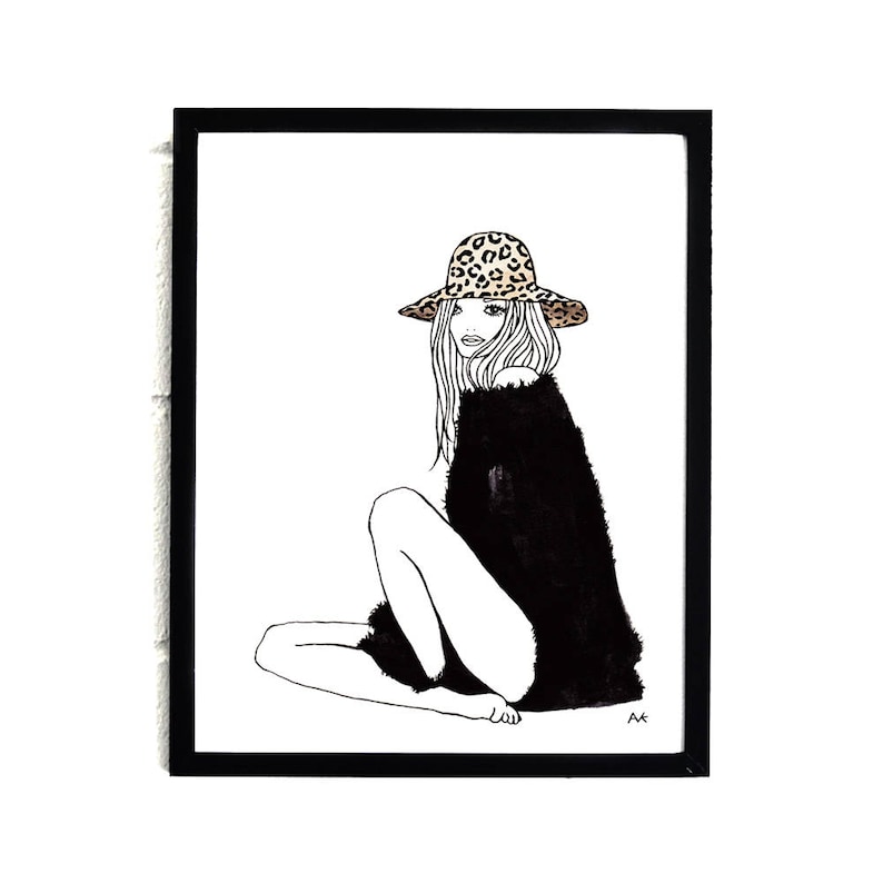 May include: Black and white line drawing of a person wearing a leopard print hat and a black sweater. The person is sitting with their legs crossed.