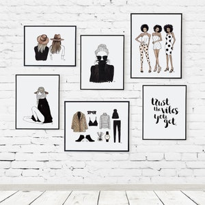 May include: A white brick wall with six framed prints. The prints feature black and white illustrations of women wearing various outfits and accessories. One print has the text "Trust the vibes you get".