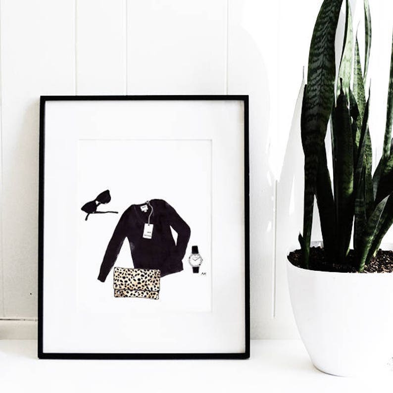 May include: A black framed print with a white background. The print features a black sweater, a leopard print clutch, sunglasses, and a silver watch.