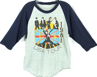 Maglietta vintage del tour USA dei Kinks del 1981, modello baseball a cuciture singole, con maniche raglan e bordi a contrasto, anni '80.