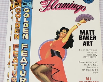 May include: A stack of vintage "Flamingo" comic books, featuring Matt Baker art. The covers show a woman in a red dress and the text "Golden Features". The comics are from 1988.
