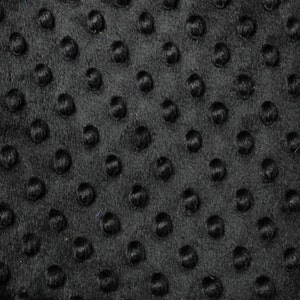 May include: Black fabric with a textured pattern of small raised dots.